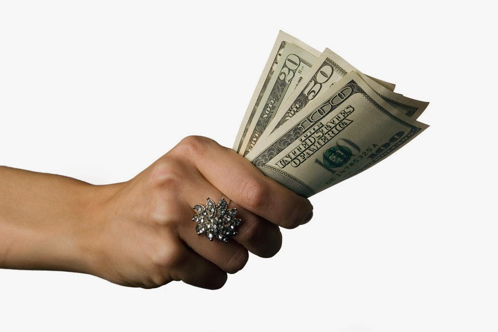 Hand holding money
