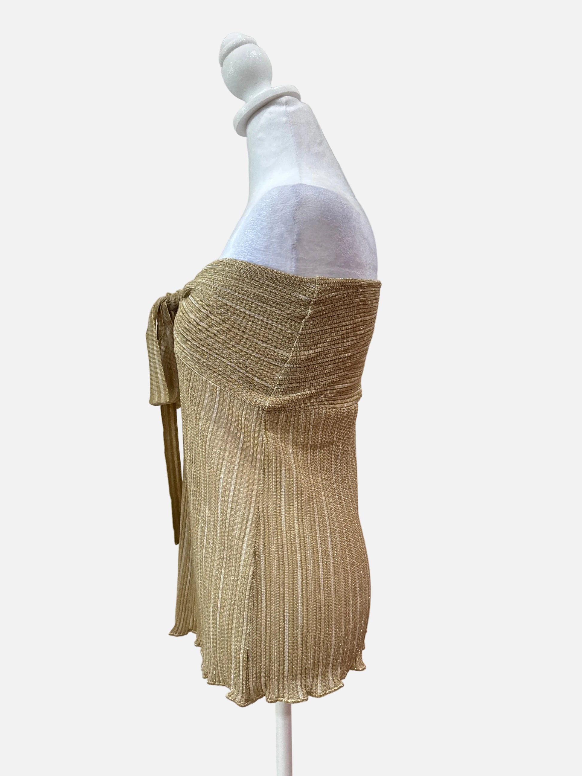 Gold pleated fabric on a white background