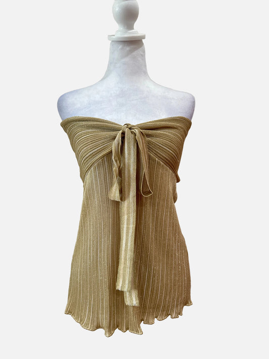 Mannequin wearing a gold dress with pleated details on a white background